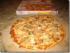 Dr. Oetker's Ristorante thin crust Funghi Pizza that was cooked on a pizza stone with the frozen pizza box in the background.