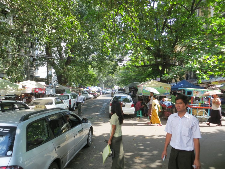 Can you see the men sitting on tiny, plastic stools?  The were conducting business meetings there.