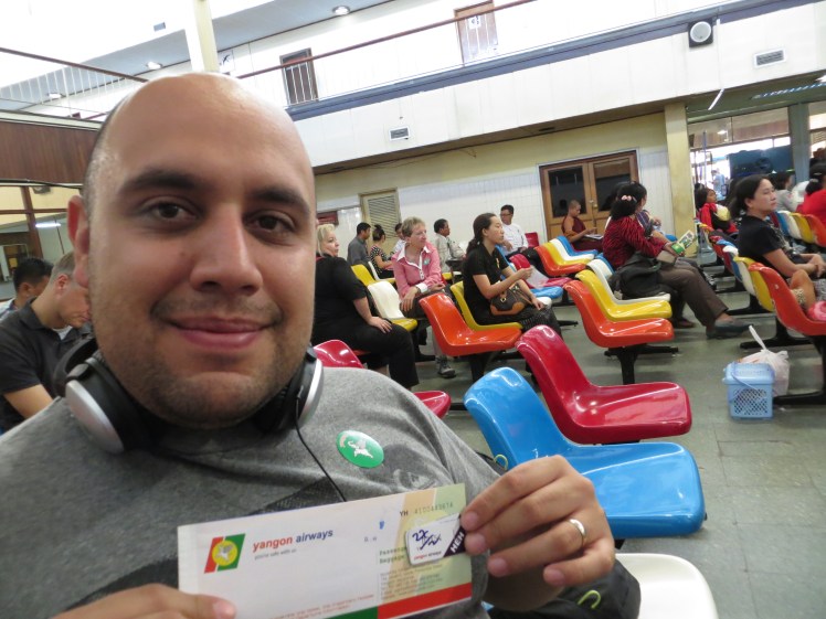 Armando with his paper ticket and boarding pass sticker at Yangon International Airport.  This was in the old terminal to catch a domestic flight to Heho, Myanmar.  