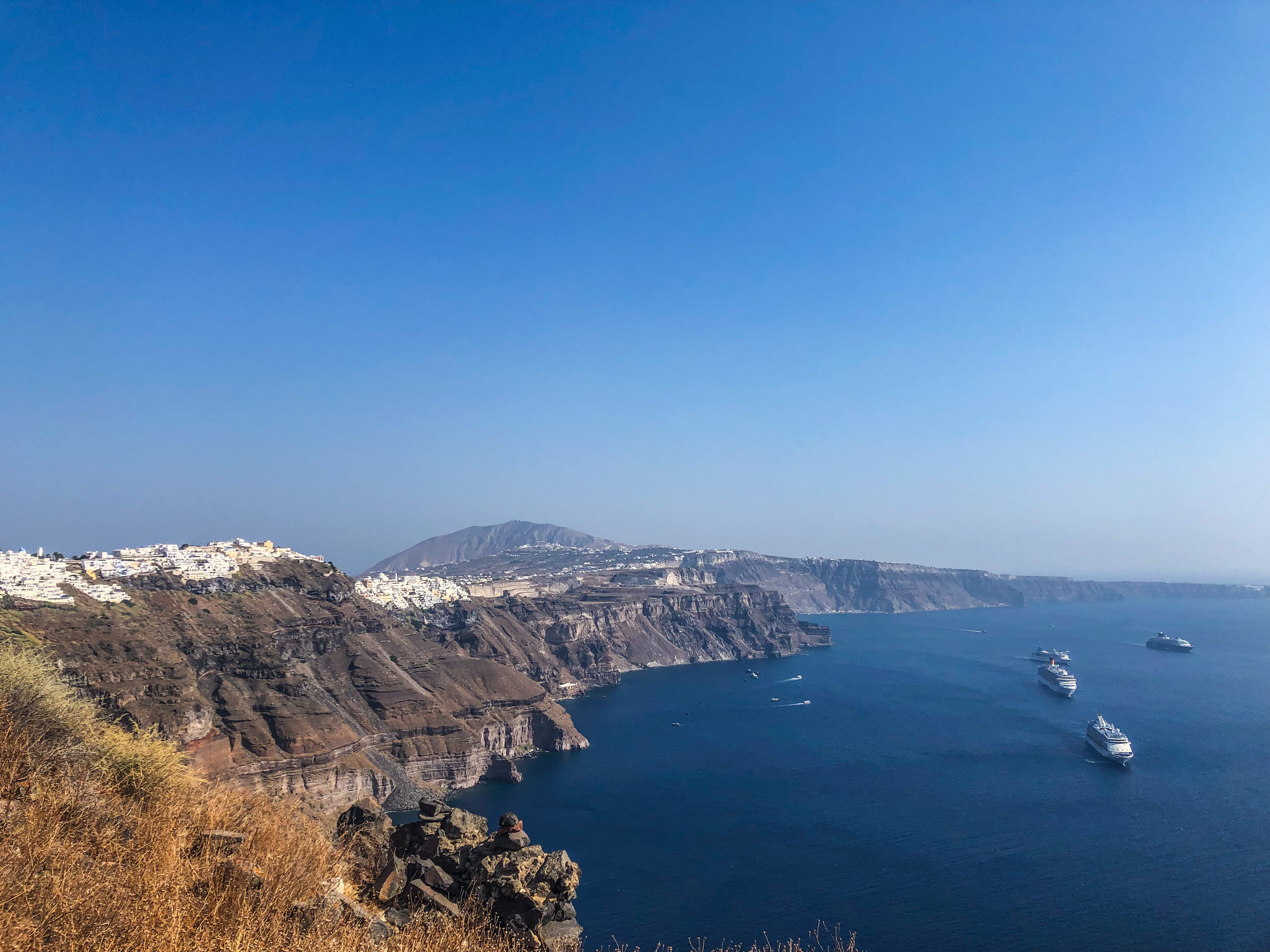 View of Fira in the distance and the cruise ships that will tender thousands of people onto the island for the day.