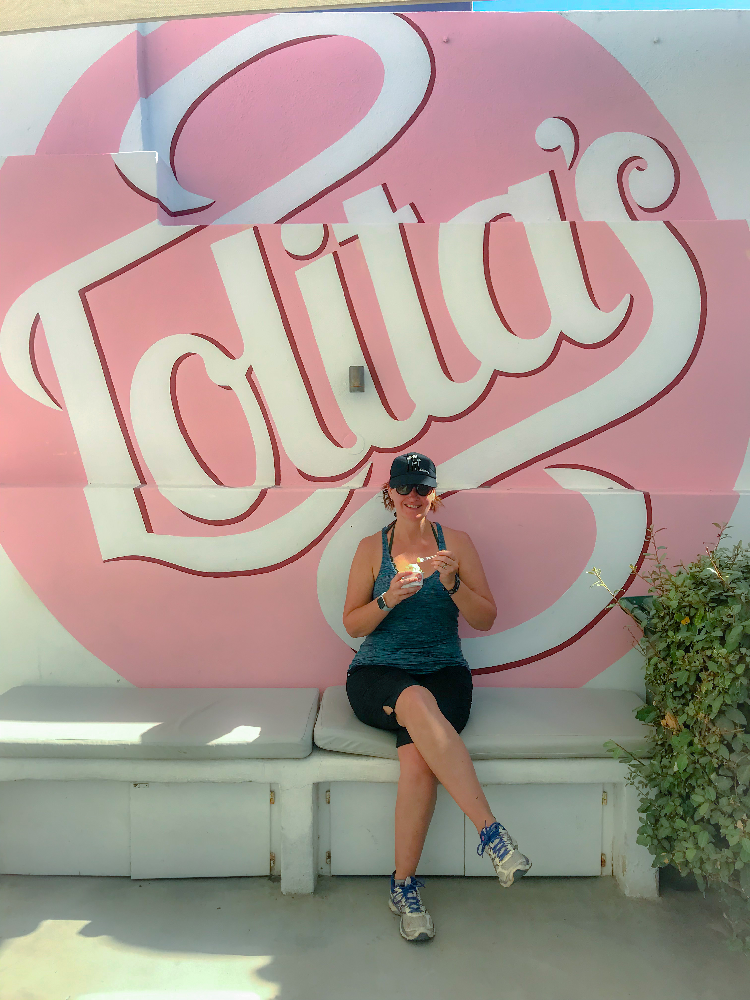 Sitting on the patio at Lolita's Gelato in Oia, Santorini enjoying a bowl of their gelato.