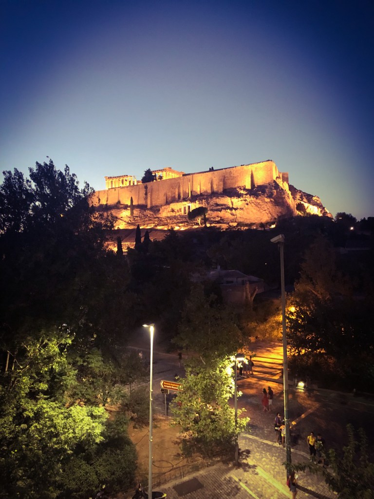 View of the Acropolis lit up at night from our Airbnb balcony.