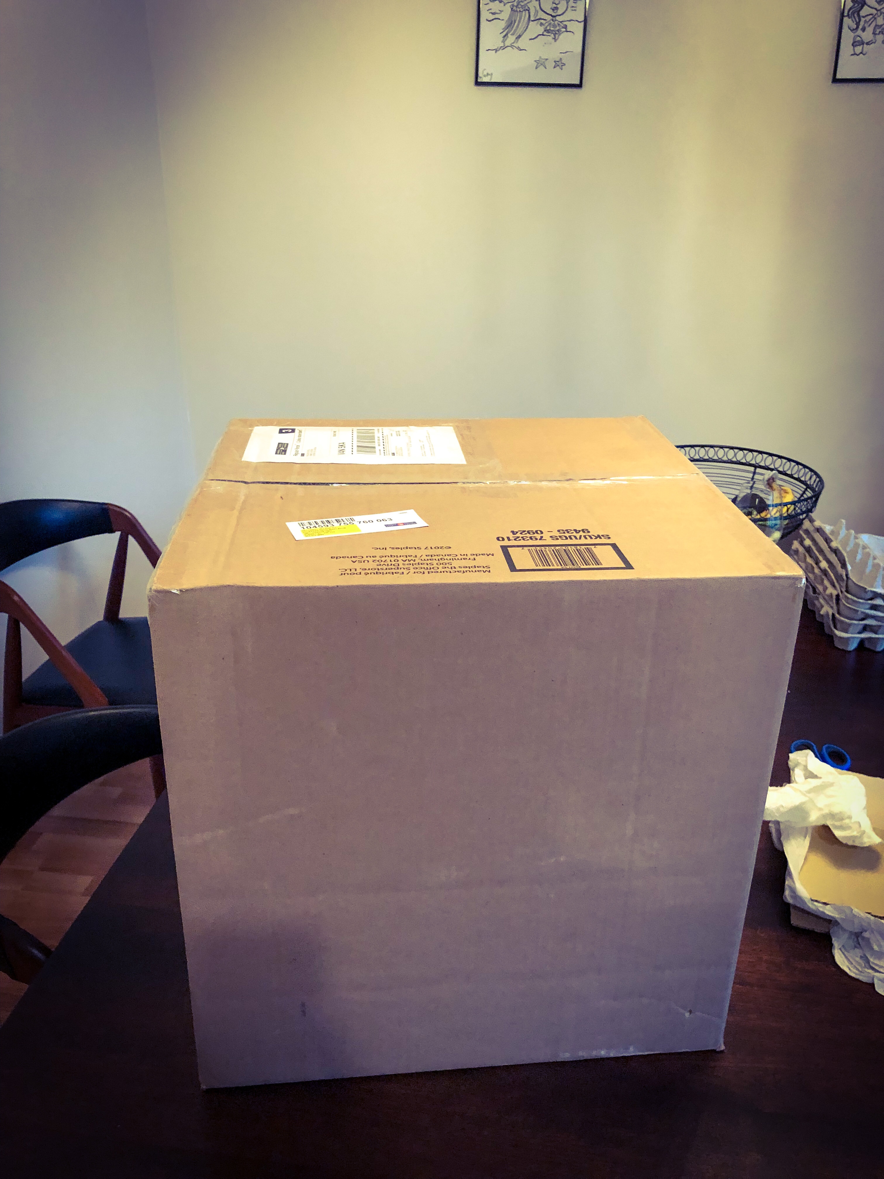 A large unopened box sitting on a table.