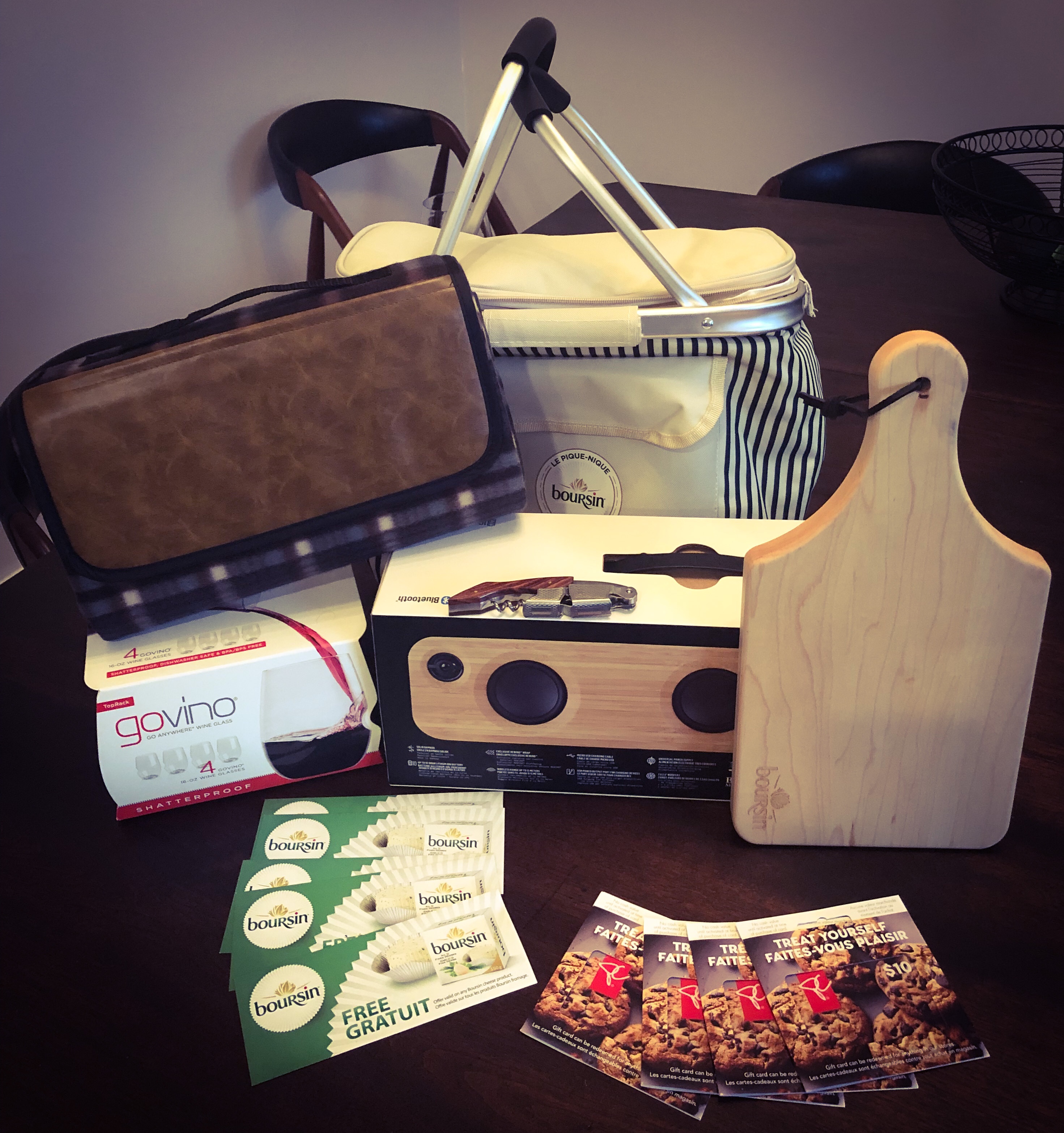 The grand prize chic picnic set we won from the Boursin Summer Contest that included a picnic bag, picnic blanket, cheese board, 4 wine glasses, corkscrew, grocery store gift cards, 5 coupons for free Boursin cheese and a Marley wireless speaker. 